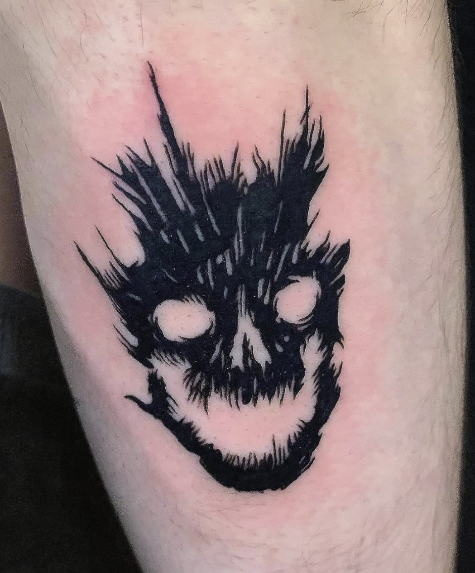 Blackwork skull tattoo by Daniel Greene