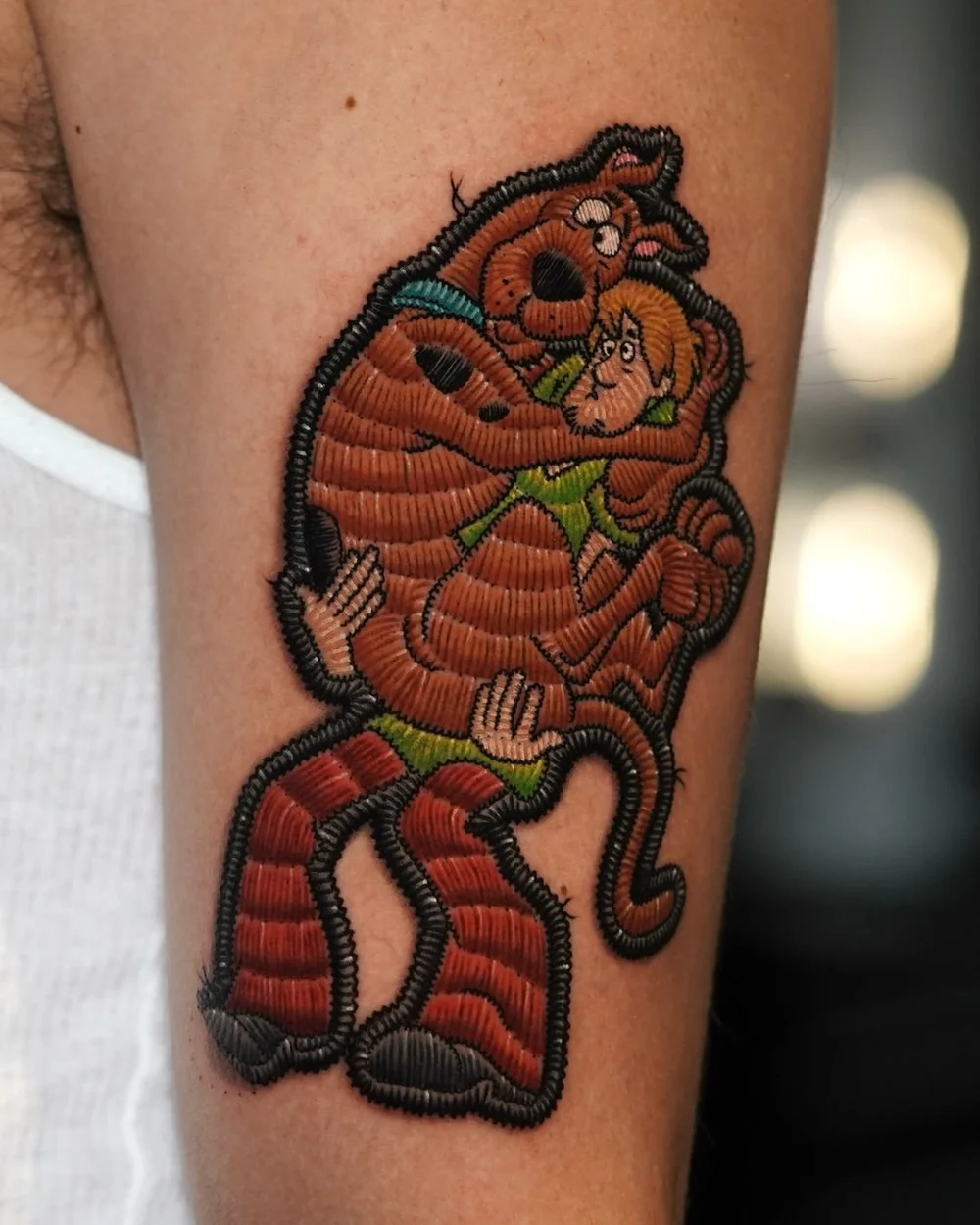 Embroidered patch-style Scooby-Doo and Shaggy tattoo by Pony Lawson
